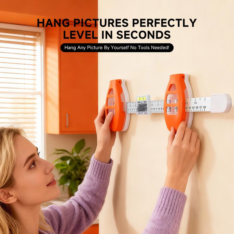 A person hanging a picture perfectly level with TrueHang